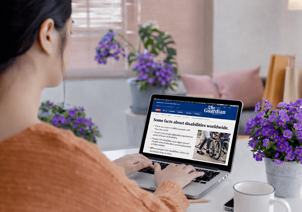 Person performing accessibility testing by reviewing a website on a laptop, showing real content and usability checks in practice.