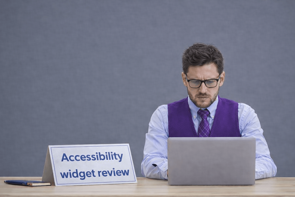 Accessibility specialist reviewing the AccessiBe accessibility widget on a laptop as part of an accessibility widget evaluation.